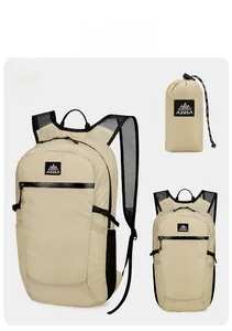 Detail view of khaki lightweight folding backpack with mesh straps and storage pouch