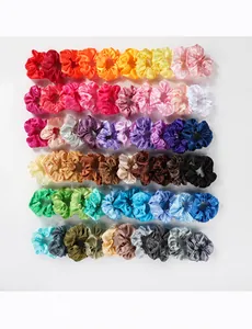 Detailed view of colorful 4.3 inch satin hair scrunchies set in various vibrant shades