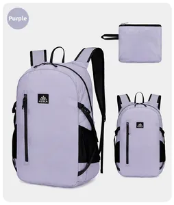 Detail of purple hiking backpack showing main zippers and compact folded storage form
