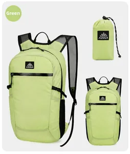 Detail showing the lightweight green foldable backpack with its compact storage pouch
