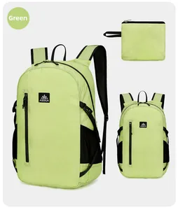 Detail view of foldable green hiking backpack with storage bag and water-resistant nylon