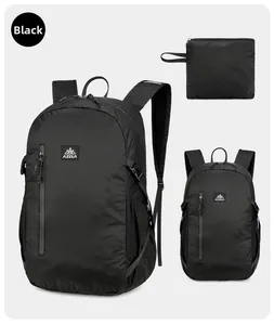 Foldable black hiking backpack showing tear-resistant diamond texture and compact design
