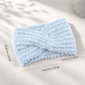 Winter light blue knitted cross headband with soft chenille texture and warm twist design