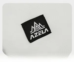 Close-up of AZELA brand logo on waterproof ripstop fabric of a mountain hiking backpack
