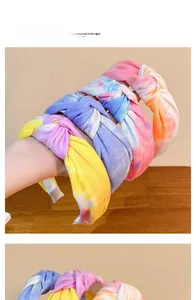 Detailed close-up showing tie-dye fabric textures and top knotted design of fashion headbands