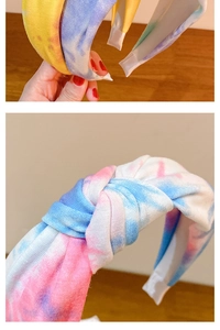Close-up of wide tie-dye knot headband featuring colorful gradient fabric texture