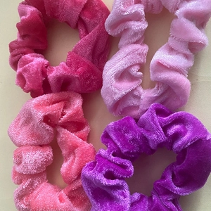 Set of 4 soft velvet hair scrunchies in vibrant pink and purple tones for women