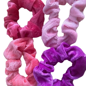 Set of four satin scrunchies in pink and purple colors for women's hair styling