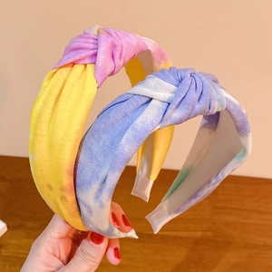 Chic tie-dye knotted headband set with vibrant gradient colors and soft cotton fabric