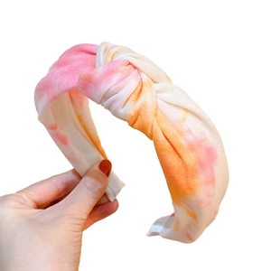 Fashionable tie-dye wide headband with pink and orange knot design for women