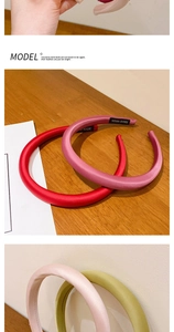 Detail of satin padded headbands in multiple colors featuring a soft texture finish