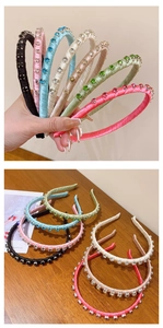 Close-up of six colorful fabric wrapped headbands with shimmering rhinestone accents