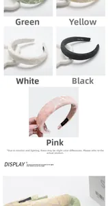 Detailed view of heart-patterned padded headbands in various colors with handmade labels