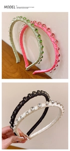 Detail shot of vintage baroque headbands featuring colorful inlaid crystals and satin fabric