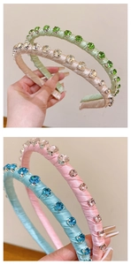 Detailed close-up of padded velvet headbands with matching colorful rhinestones