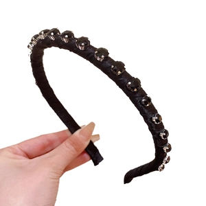 Baroque style headband with black rhinestones on a satin band for women's hair styling