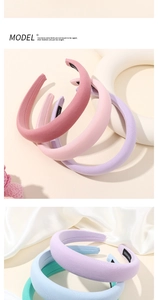 Detail view of thickened sponge headbands in soft pastel macaron colors with handmade label