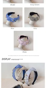 Detail of wide knotted pearl headbands in khaki, green, blue, gray, and pink fabrics