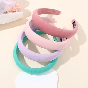 Set of 4 padded sponge headbands in Morandi colors with textured fabric covering