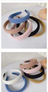 Close-up of handmade waffle fabric padded headbands with professional HANDMADE label