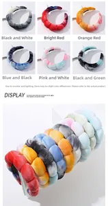 Close-up of thick tie-dye sponge headbands in various colors with soft velvet texture