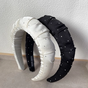 Ruched padded headband with sparkling rhinestones in classic black and cream white