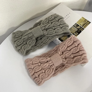 Winter chunky knit headband for women in grey-green and soft pink with bow knot design