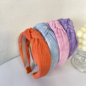 Set di quattro cerchietti intrecciati tie-dye in maglia arancione, blu, rosa e viola