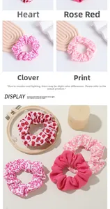 Detailed set of pink floral and heart pattern fabric scrunchies for bun hairstyles