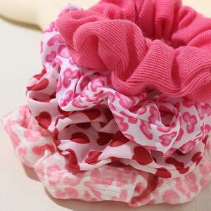Pink heart and floral scrunchies set in knit and satin fabrics for women hair styling