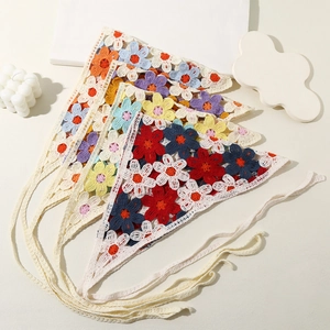 Detail of colorful crochet flower bunting with high-quality handmade knitted texture