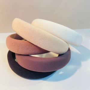 Set of 4 padded sponge headbands in pink, purple, white and beige colors
