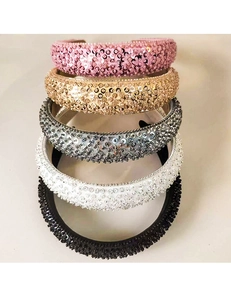 Detail of padded headbands featuring glittering sequins and small beads in five colors