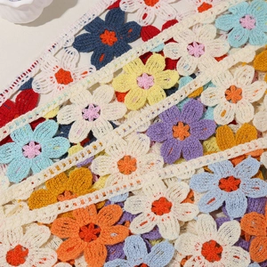 Floral crochet headband with colorful daisy knit patterns in a sweet pastoral style