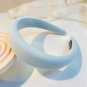 Detail of light blue padded sponge headband with handmade woven fabric texture