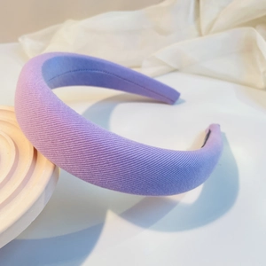 Detail of light purple padded headband showing textured rib knit fabric and thick volume