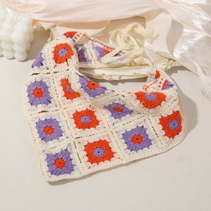 Detail of handmade crochet floral headscarf with granny square pattern and tie straps