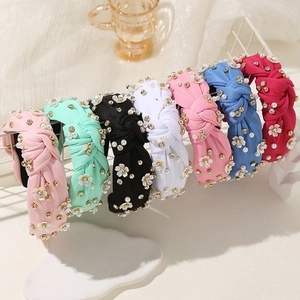 Set di cerchietti annodati con fiori, perle e strass in sette eleganti colori pastello