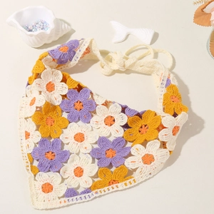 Detail of floral crochet cotton headband featuring colorful knit flowers and lace trim