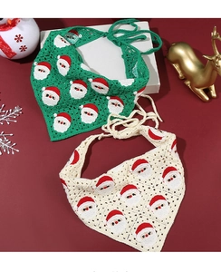 Detailed close-up of handmade crochet Christmas headband with Santa Claus patterns