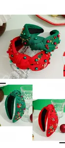 Detailed close-up of Christmas headbands with red and green velvet and festive embroidery