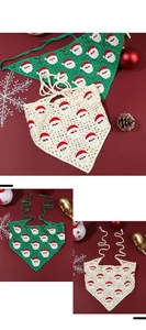 Detail of handmade crochet Christmas kerchief with Santa Claus patterns and knit texture