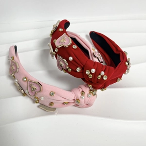 Knit twisted headband with pink and red enamel hearts, pearls and crystals