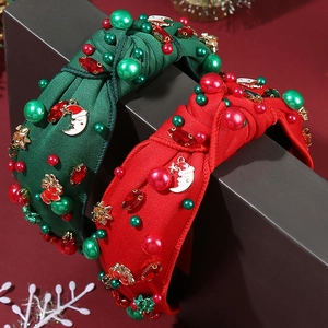 Cerchietto natalizio largo a nodo con perle e ciondoli Babbo Natale nei colori rosso e verde