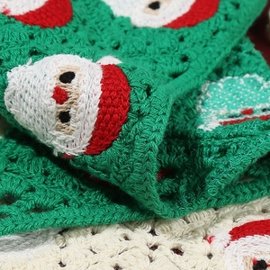 Handmade crochet Christmas kerchief with festive Santa Claus knit patterns for women
