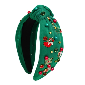 Knotted Christmas headband in forest green knit with festive charms and colorful pearls