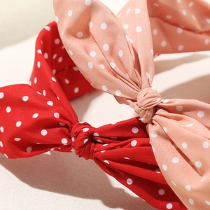 Cerchietti a pois rossi e rosa con nodo a fiocco per acconciature da donna