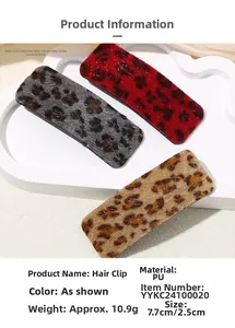 Detailed view of leopard print hair clips showing exact 7.7cm x 2.5cm dimensions