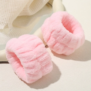 Plush pink cloud headbands and wristbands set for face washing and skincare routines