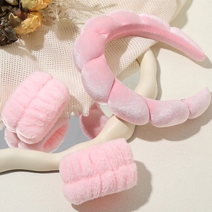 Pink plush headband and wristband set for face washing with soft coral fleece texture